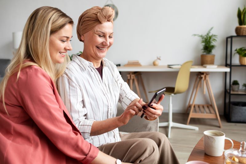 Senior smiling at home with caregiver